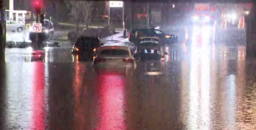 cars driving through standing water. Dangerous.